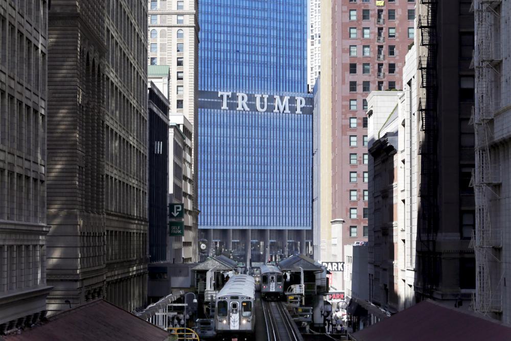 TRUMP on the side of a building in a city